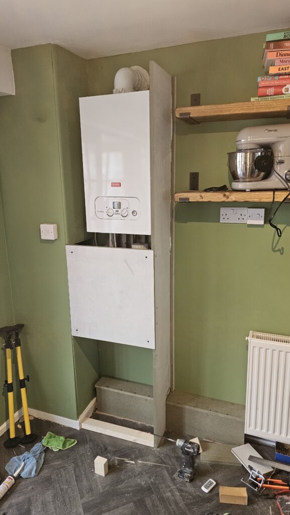 Boiler boxing and pipe boxing installation in progress with storage section taking shape