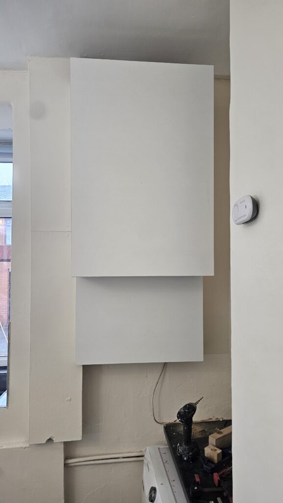 Finished custom boiler boxing in a refurbished kitchen with a clean painted finish