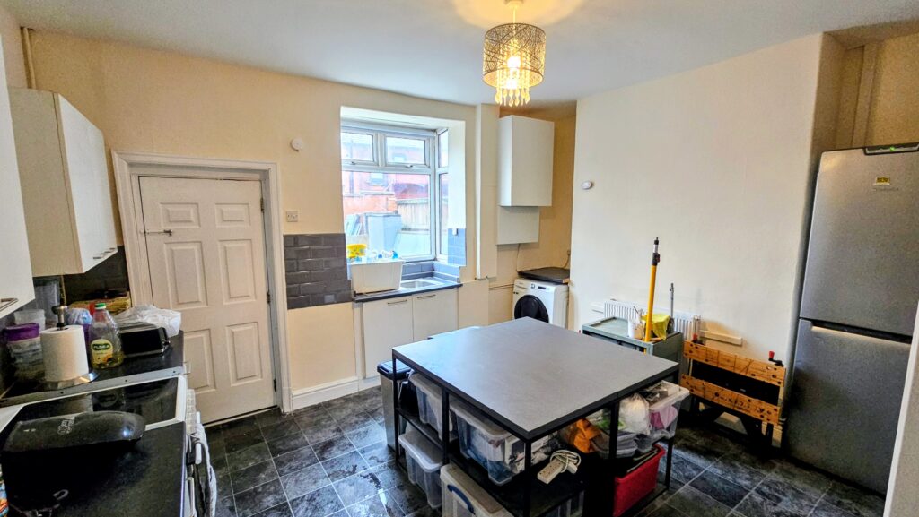 Refurbished kitchen with painted walls, plastered surfaces and custom boxing around the boiler area
