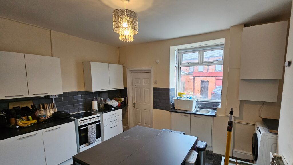 Refurbished kitchen with painted walls, plastered surfaces and custom boxing details