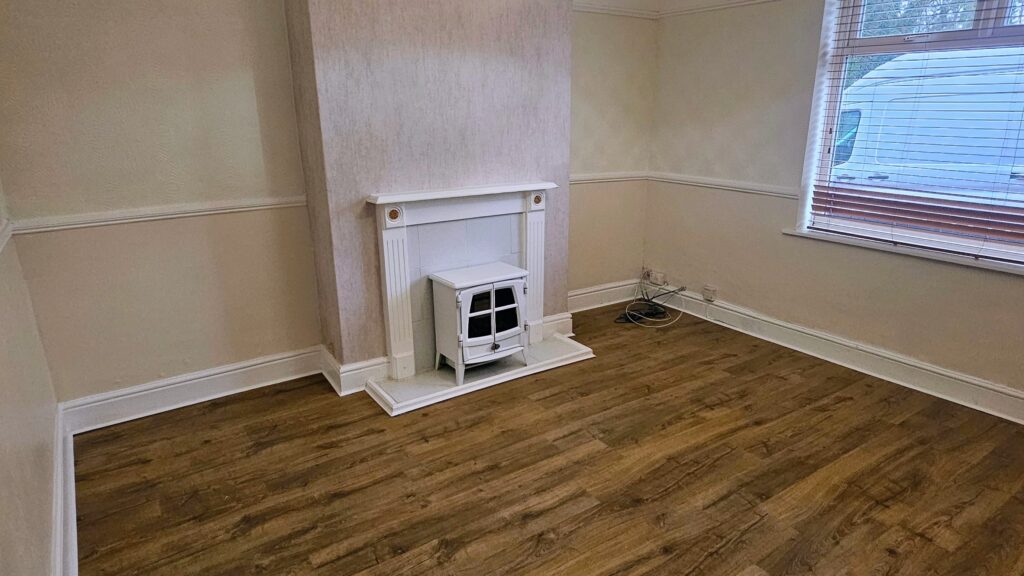 completed-living-room-refurbishment-fireplace-and-new-laminate-flooring