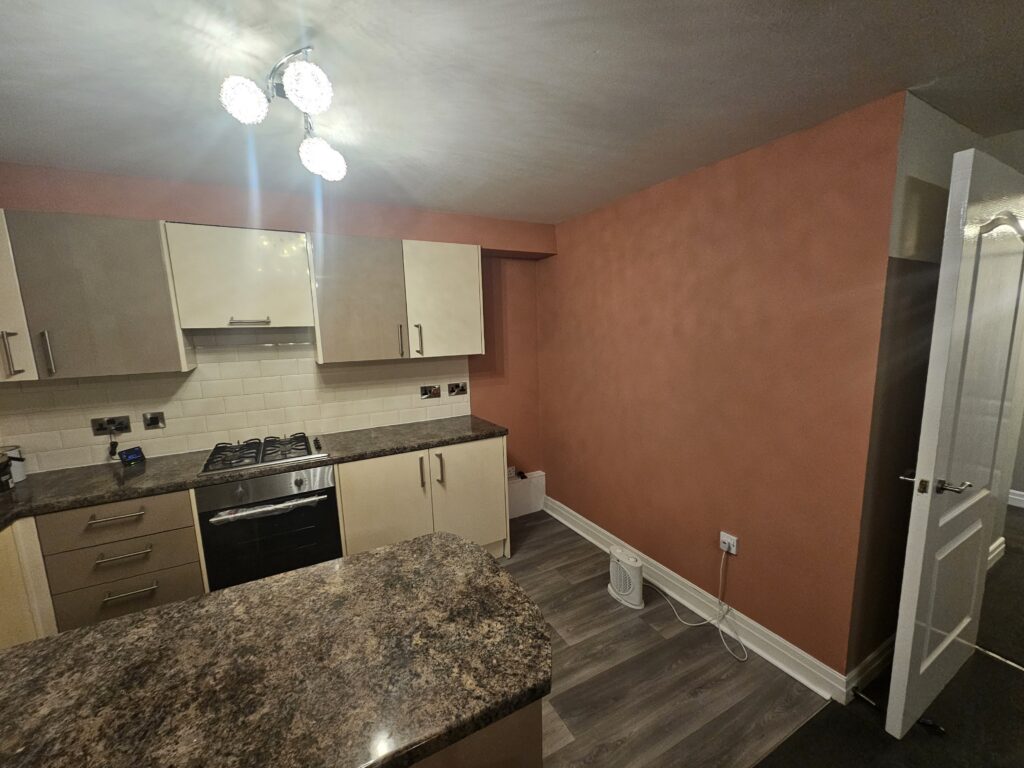 Completed kitchen painting project with refreshed walls and a clean updated finish