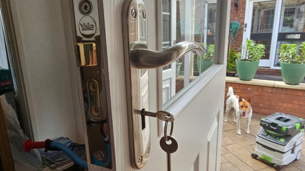 New door and lock installation with chrome handle and Yale lock fitted