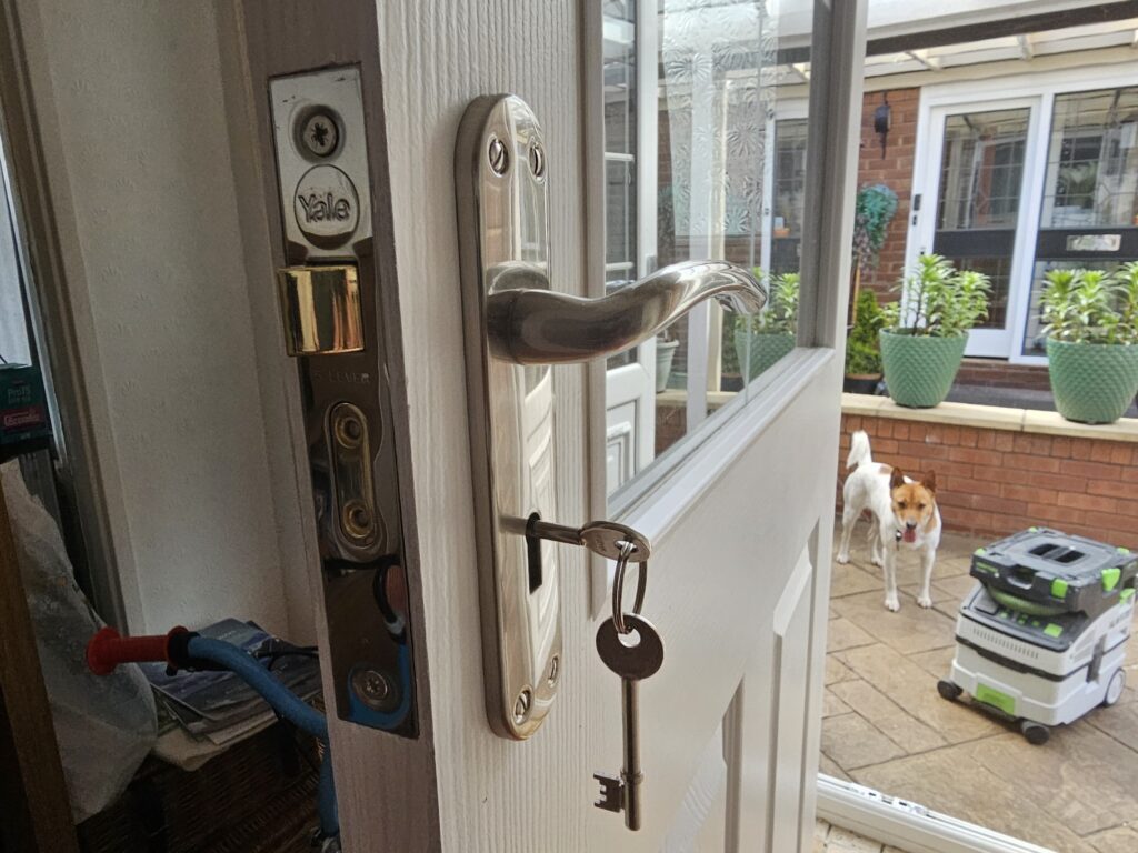 New door and lock installation with chrome handle and Yale lock fitted