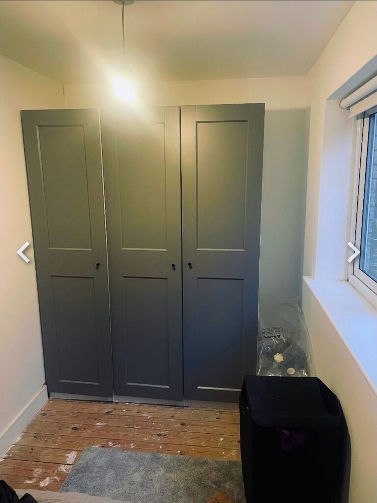 IKEA PAX wardrobes before built-in conversion showing gaps around units in bedroom alcove in Shipley