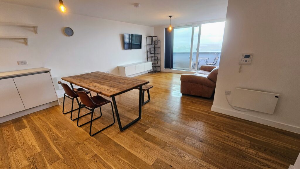 After repairing the timber floor: the dark marks have been reduced and the finish looks even and refreshed.