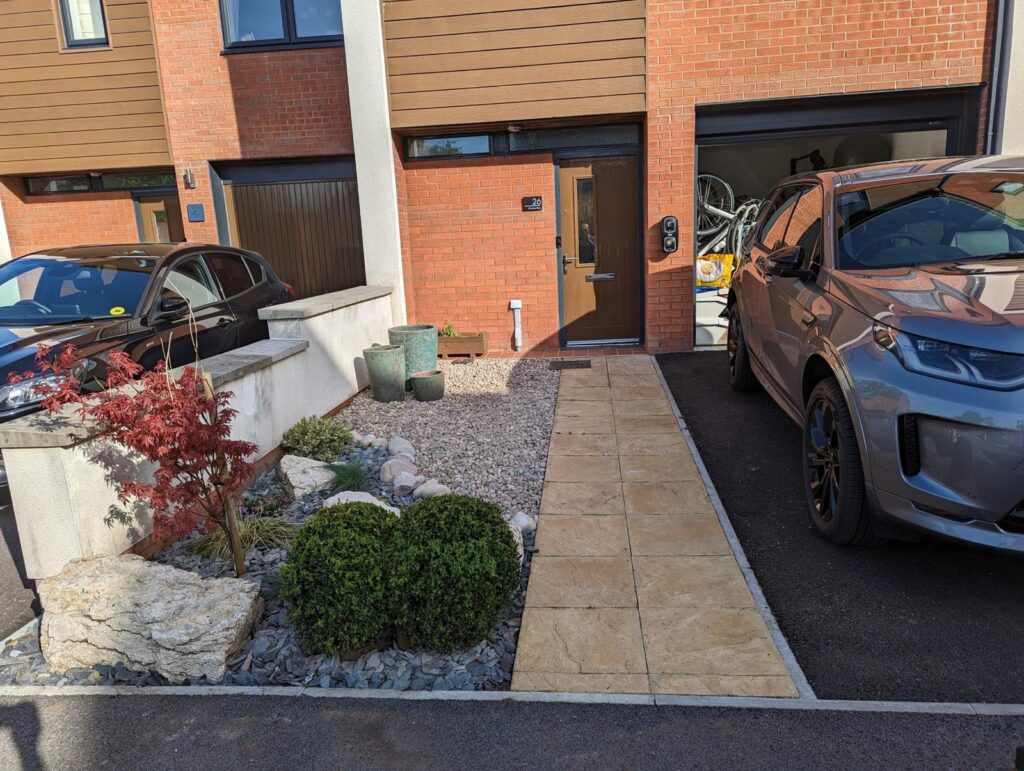 Front garden area before installing a concrete base for a bike storage box.