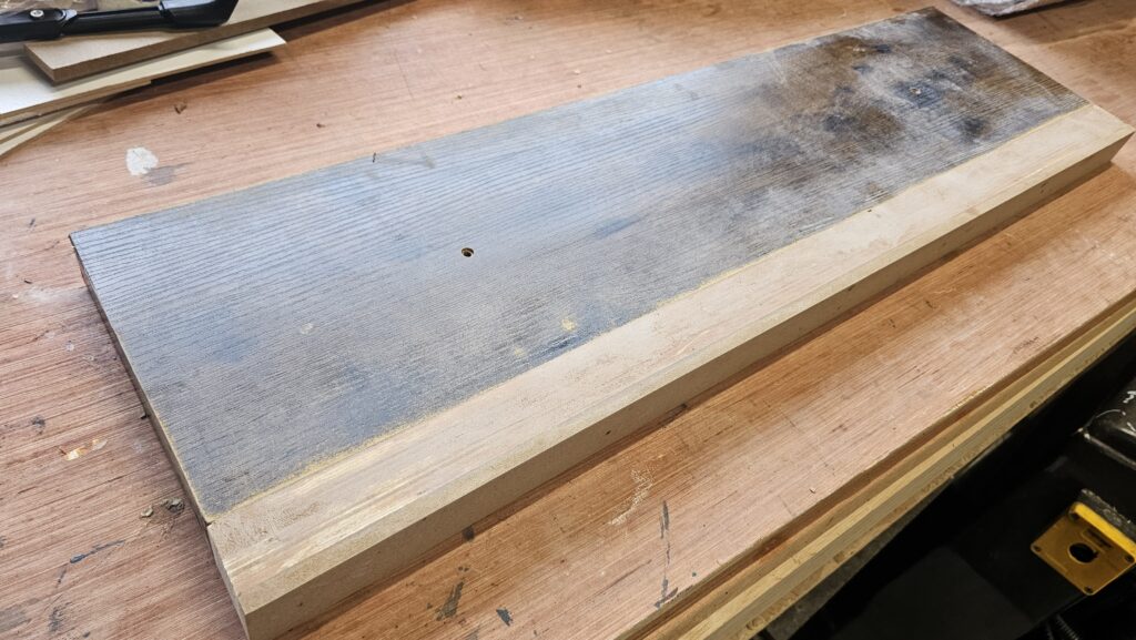 Ready-made shelf board being resized and extended before applying the new wood veneer finish.