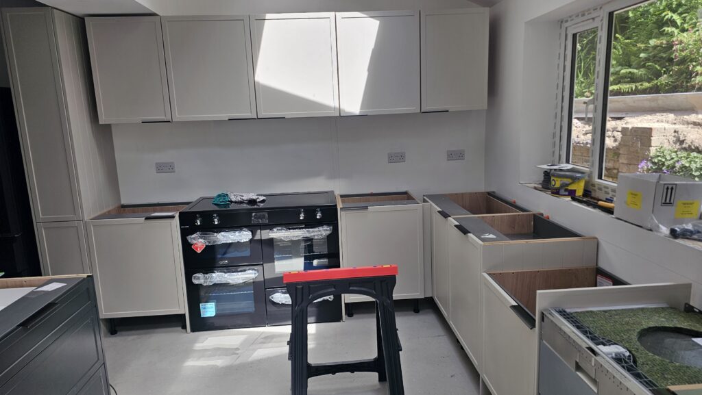 Second view of the kitchen before installing L-shaped worktops, breakfast bar and splashback in Manchester