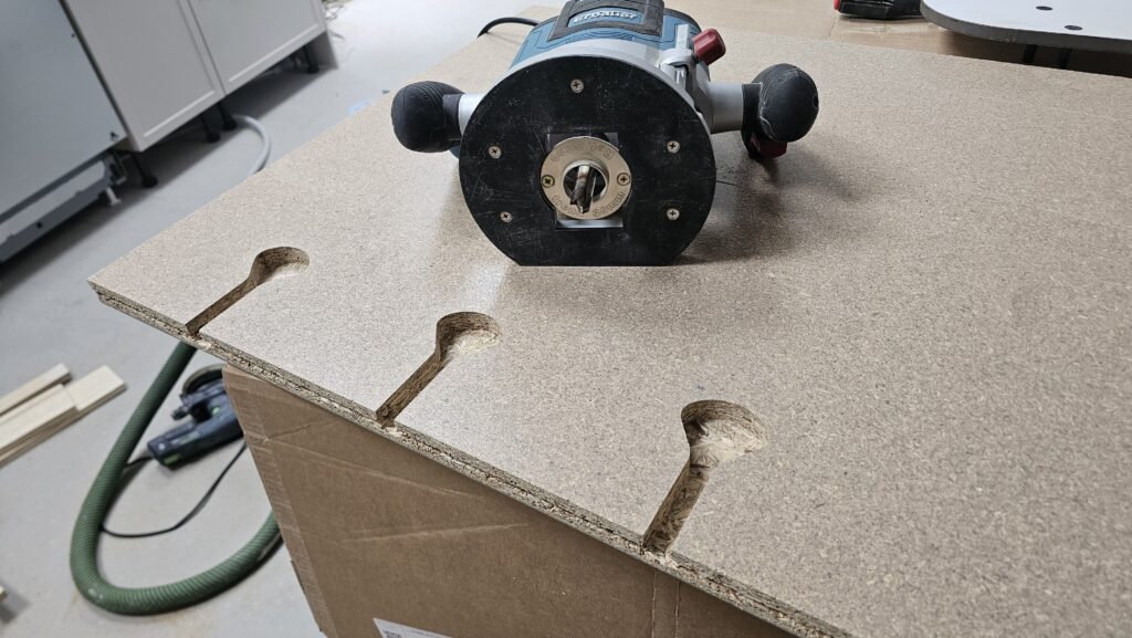 Routing mason's mitre bolt slots into a laminate kitchen worktop for a secure L-shaped joint