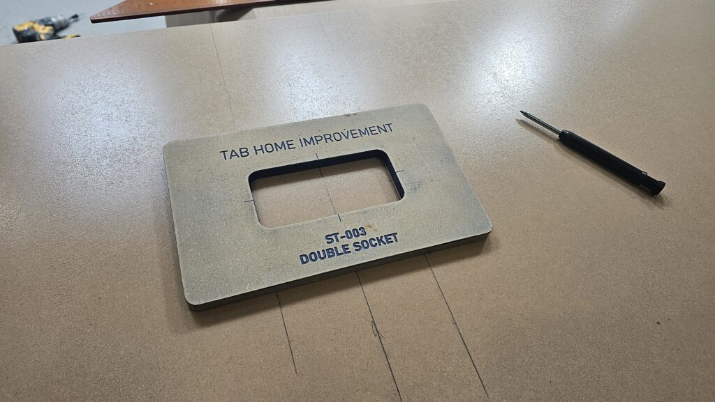 Custom-made TAB Home Improvement double socket routing template for accurate back panel cut-outs