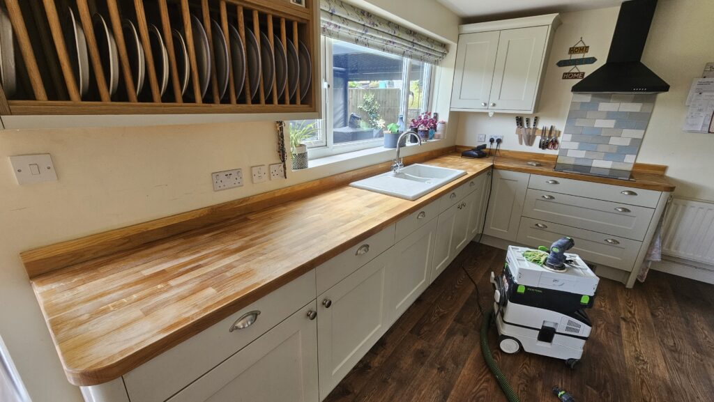 Restored solid oak kitchen worktops after sanding and refinishing with hard wax oil.