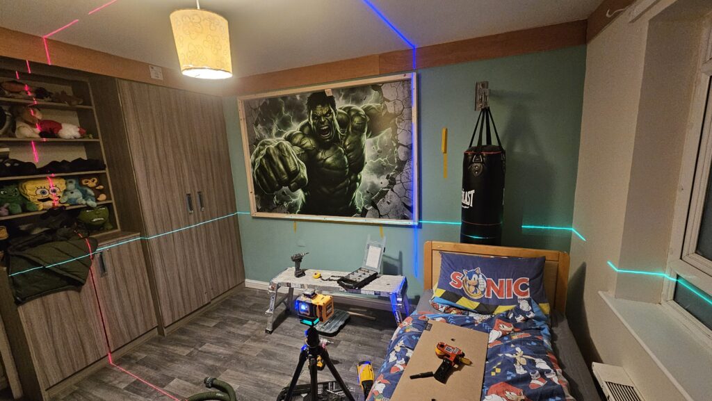 Installing the bespoke Hulk illuminated feature panel in the themed bedroom
