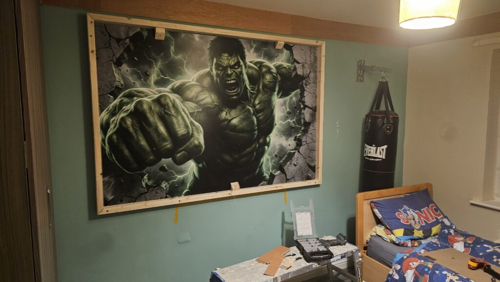 Installed bespoke Hulk feature lightbox in the themed bedroom before final lighting and ceiling completion