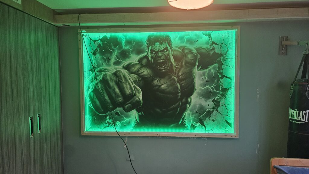 Testing the illuminated Hulk feature lightbox after installation in the themed bedroom