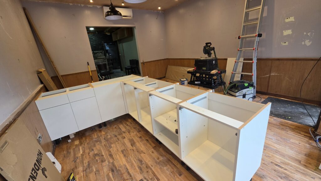 Howdens cabinet units installed to form the bespoke café counter