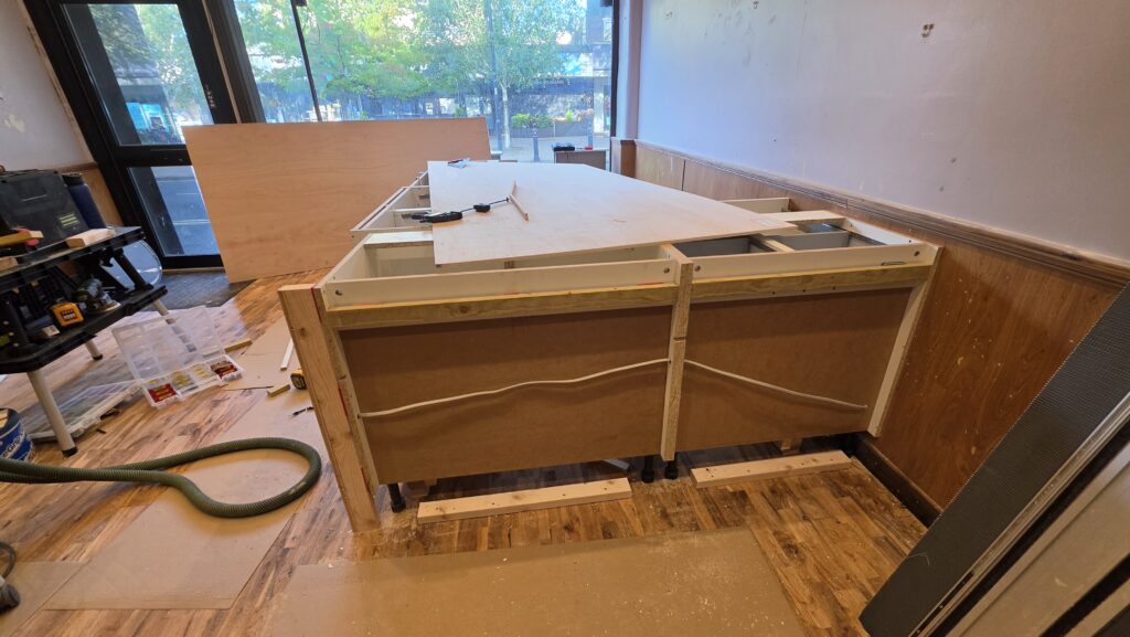 Electrical cabling routed through the café counter cabinets before final finishing